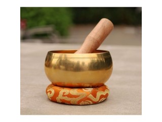 Singing bowl with wooden stick